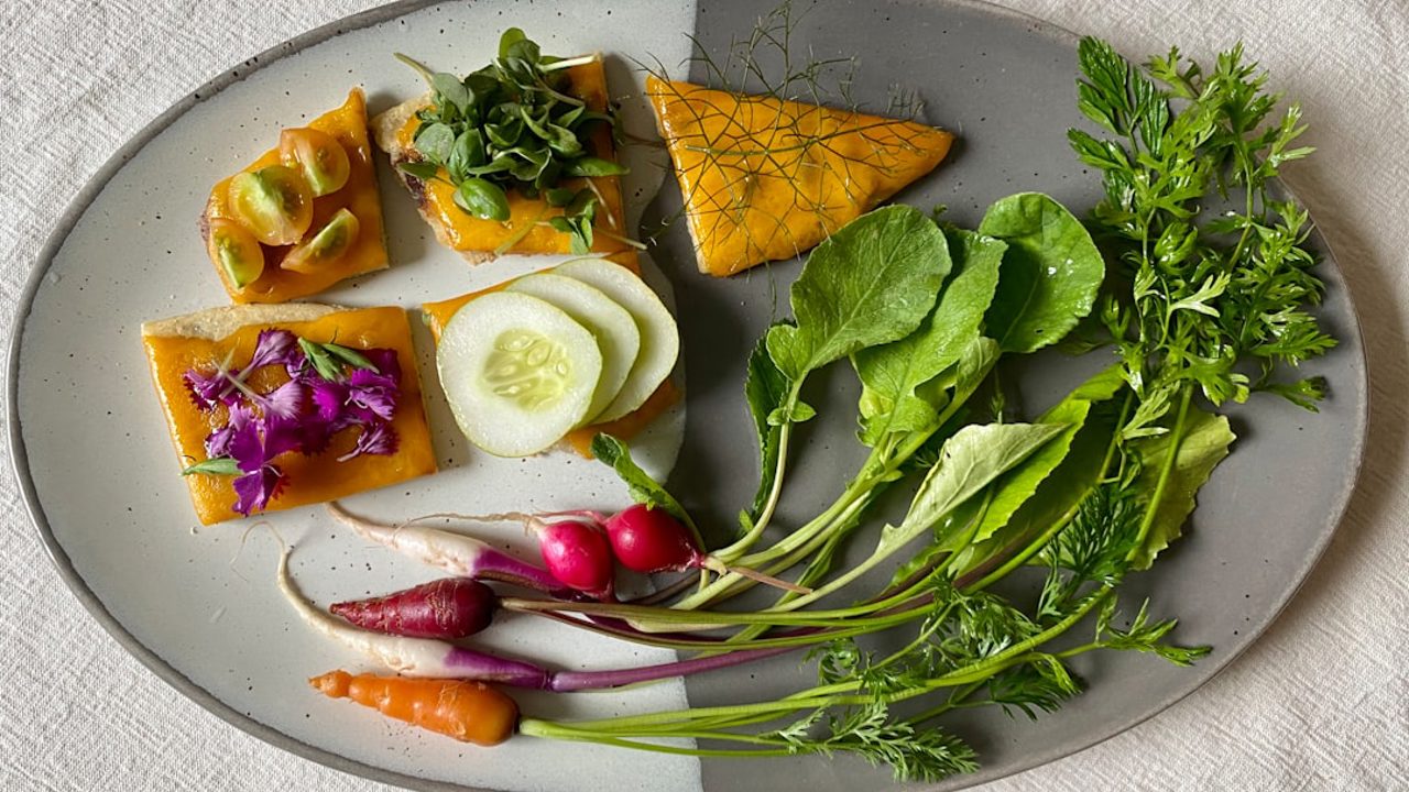 Algerian kissra bread breakfast plate with a summer garden harvest