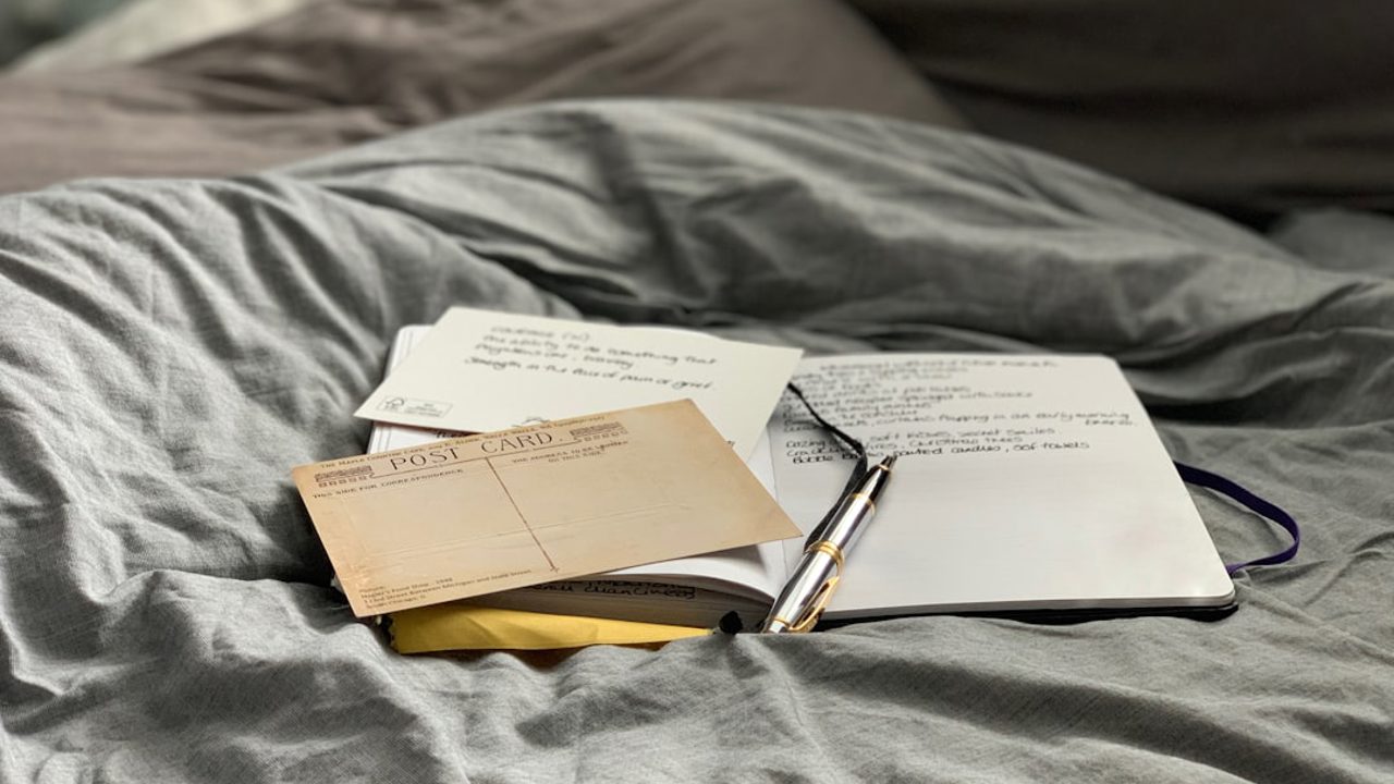 Journaling in bed with an ink pen